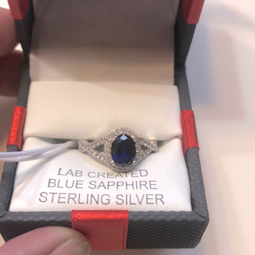 Brand new size 7 lab created blue and white sapphire ring.